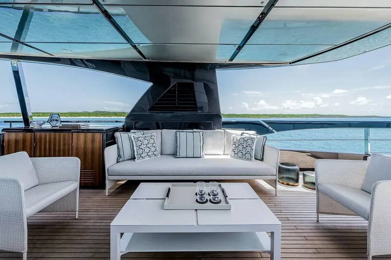 Slide: The Image of Luxurious deck of 2023 Riva 130' Bellissima yacht with elegant seating and ocean view. - 26