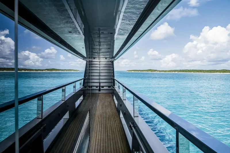 Slide: The Image of Luxurious Riva 130' Bellissima yacht corridor overlooking serene blue ocean, 2023 model. - 16