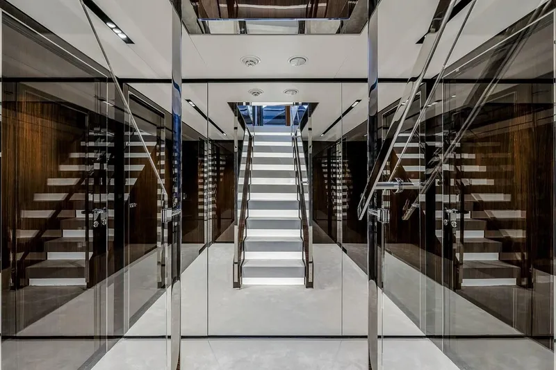 Slide: The Image of Luxurious interior of 2023 Riva 130' Bellissima yacht with modern staircase and sleek design. - 41