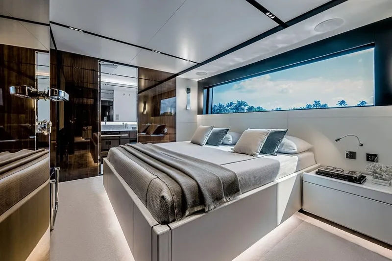 Slide: The Image of Luxurious bedroom interior of 2023 Riva 130' Bellissima yacht with modern design and large window view. - 29