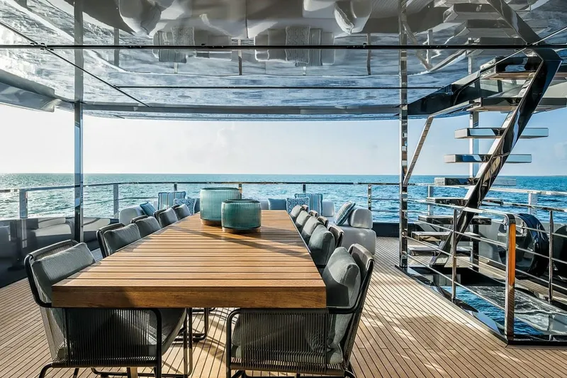 Slide: The Image of Luxurious deck of 2023 Riva 130' Bellissima yacht with ocean view and elegant dining area. - 22