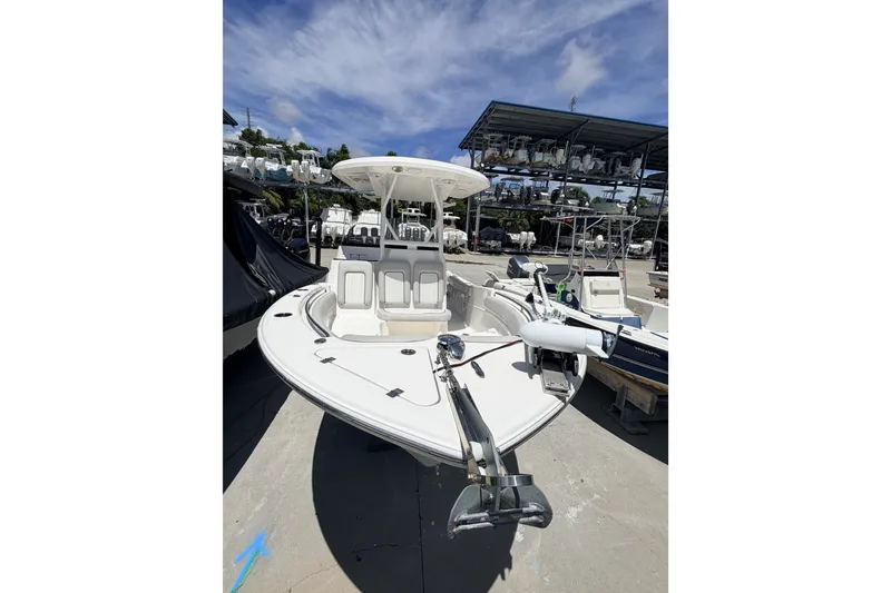 Slide: The Image of 2020 Sea Fox 249 Avenger boat displayed in a marina under a clear blue sky. - 35