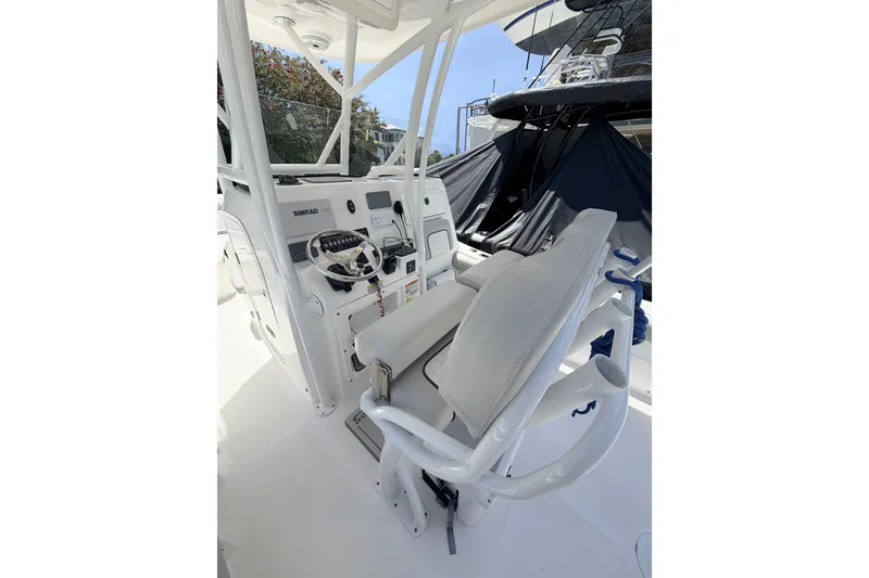 Slide: The Image of 2020 Sea Fox 249 Avenger boat helm with steering wheel and controls. - 29