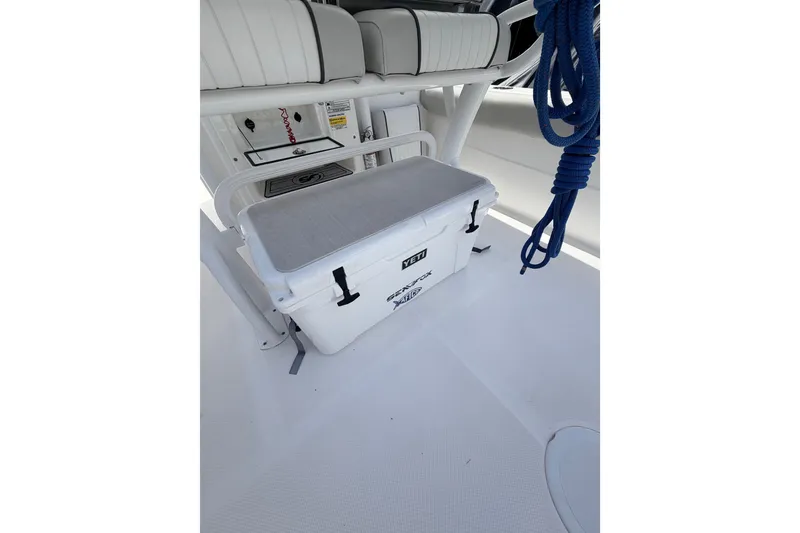 Slide: The Image of 2020 Sea Fox 249 Avenger boat interior with YETI cooler and blue rope. - 28