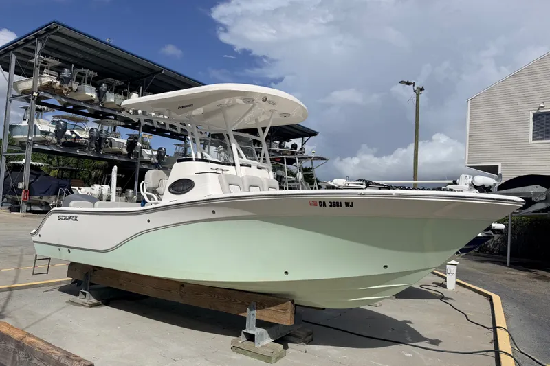 The Image of 2020 Sea Fox 249 Avenger boat on display at a marina under a cloudy sky. - 0