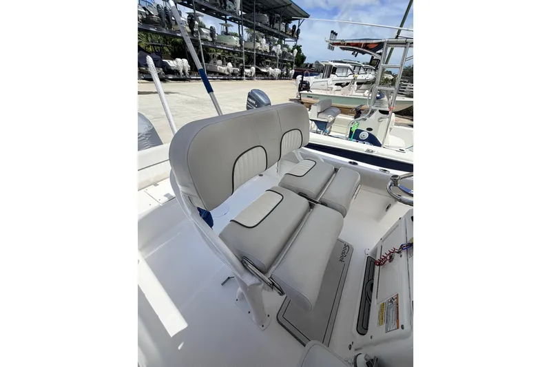 Slide: The Image of 2020 Sea Fox 249 Avenger boat interior with cushioned seating and helm station. - 21