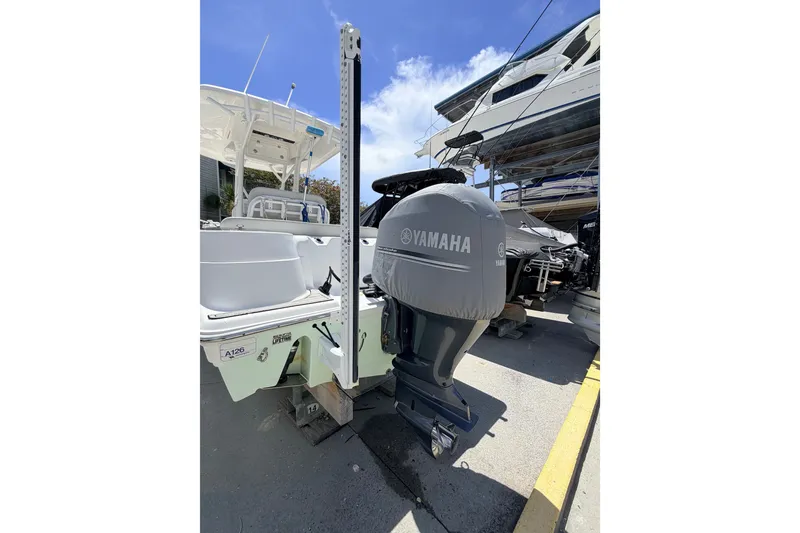 Slide: The Image of 2020 Sea Fox 249 Avenger boat with Yamaha outboard motor in marina setting. - 34