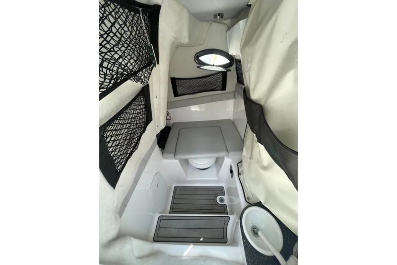 Slide: The Image of Interior cabin of 2020 Sea Fox 249 Avenger boat with storage nets and seating. - 17