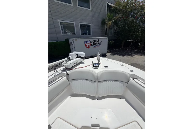 Slide: The Image of 2020 Sea Fox 249 Avenger boat interior with seating and storage facility in background. - 13