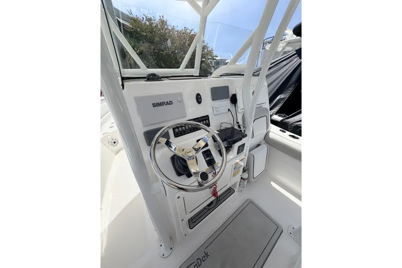Slide: The Image of 2020 Sea Fox 249 Avenger boat helm with Simrad electronics and steering wheel. - 27