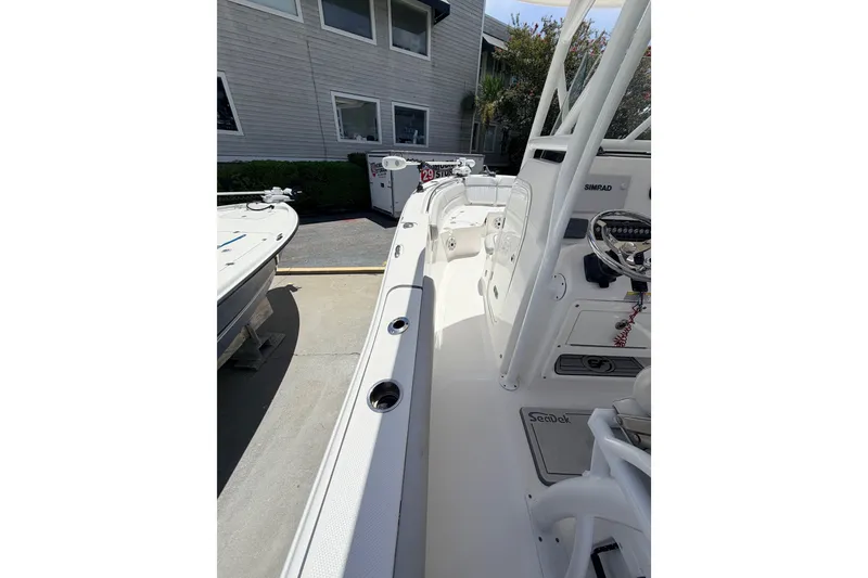 Slide: The Image of 2020 Sea Fox 249 Avenger boat interior with steering console and seating area. - 20