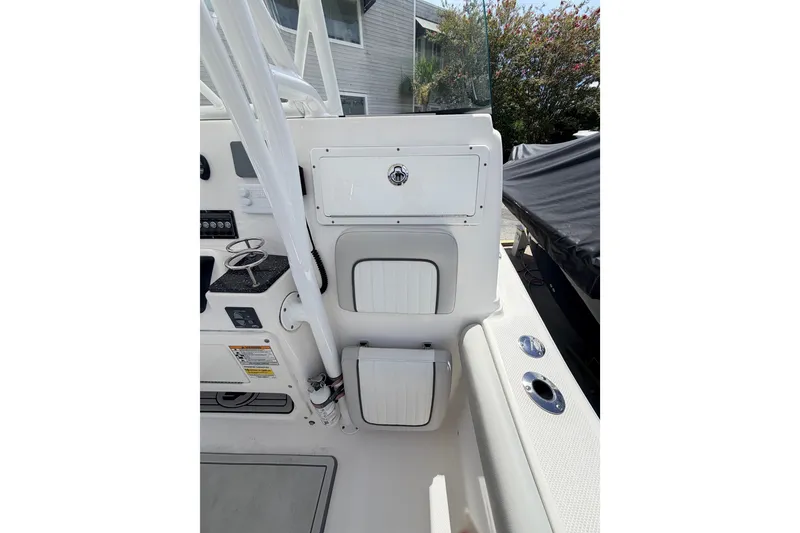 Slide: The Image of 2020 Sea Fox 249 Avenger boat interior with storage compartments and control panel. - 24