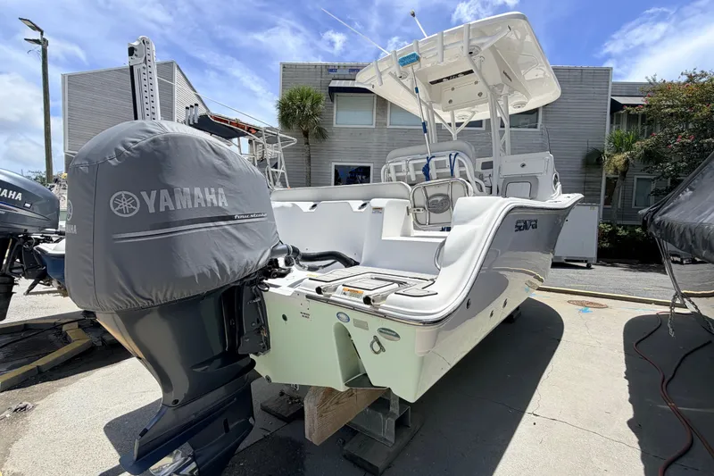 Slide: The Image of 2020 Sea Fox 249 Avenger boat with Yamaha engine, docked outdoors under clear sky. - 33