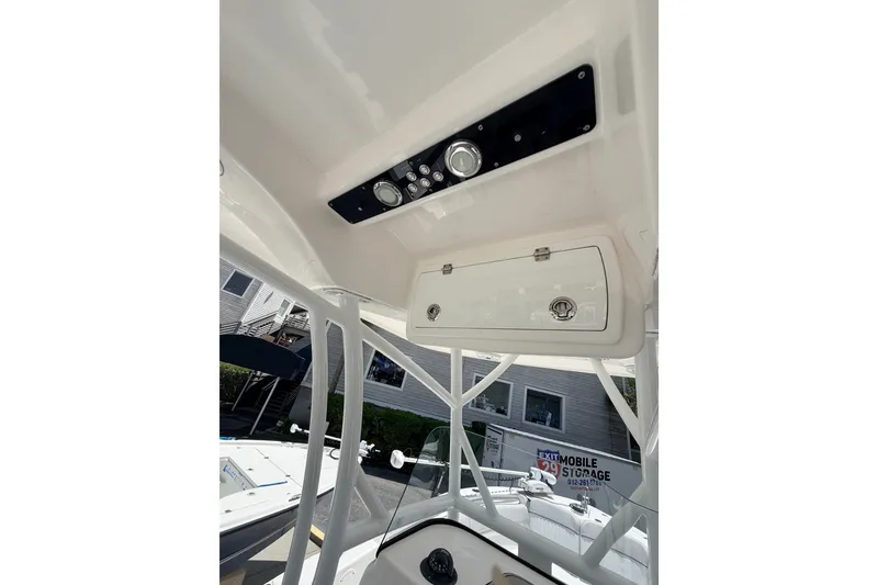 Slide: The Image of 2020 Sea Fox 249 Avenger boat console with storage and control panel. - 26