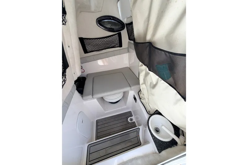 Slide: The Image of Interior of 2020 Sea Fox 249 Avenger boat, featuring seating and storage compartments. - 16