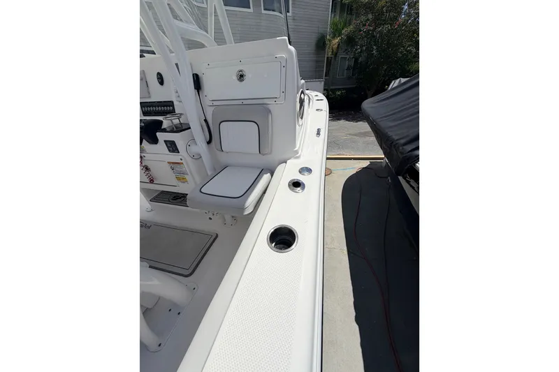 Slide: The Image of 2020 Sea Fox 249 Avenger boat interior, featuring seating and storage compartments. - 22