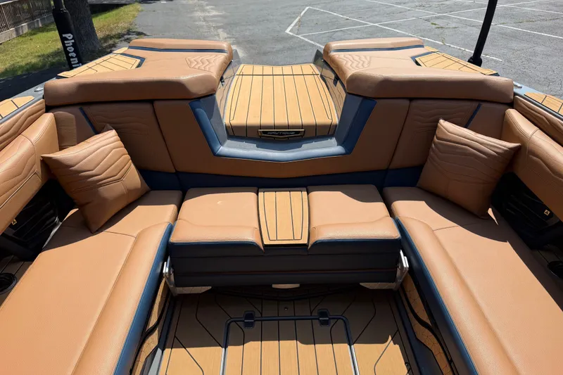 Slide: The Image of Luxurious interior of 2026 Nautique Super Air Nautique G25 boat with tan leather seating. - 16
