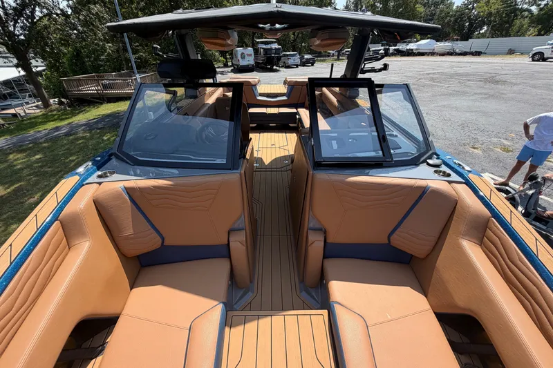 Slide: The Image of 2026 Nautique Super Air Nautique G25 interior with tan seating and sleek design. - 20