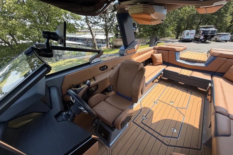 Slide: The Image of 2026 Nautique Super Air Nautique G25 interior with luxurious seating and modern dashboard design. - 21