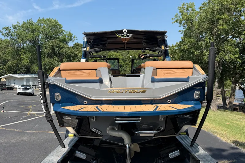Slide: The Image of 2026 Nautique Super Air Nautique G25 boat on trailer, rear view. - 9