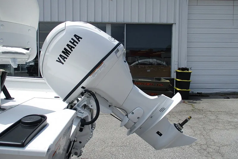 Slide: The Image of Yamaha outboard motor on a 2026 G3 Bay 17 boat, parked outside a garage. - 9
