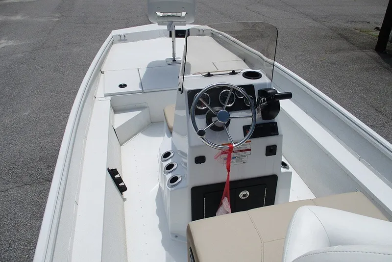 Slide: The Image of 2026 G3 Bay 17 boat interior with steering wheel and seating. - 11