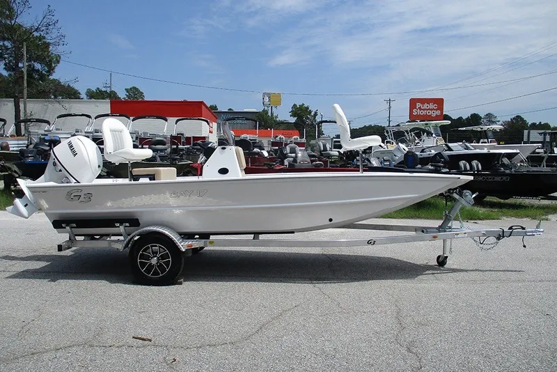Slide: The Image of 2026 G3 Bay 17 boat on trailer, parked outdoors at dealership. - 6
