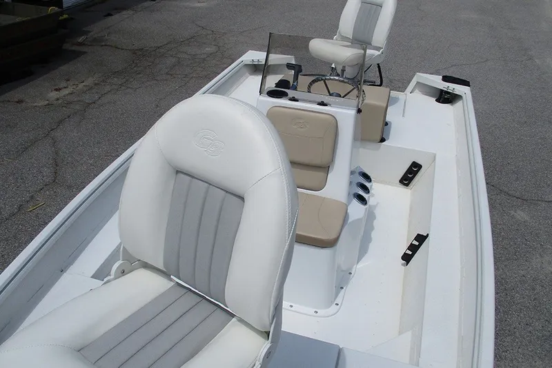 Slide: The Image of 2026 G3 Bay 17 boat interior with white and beige seating, steering console. - 10