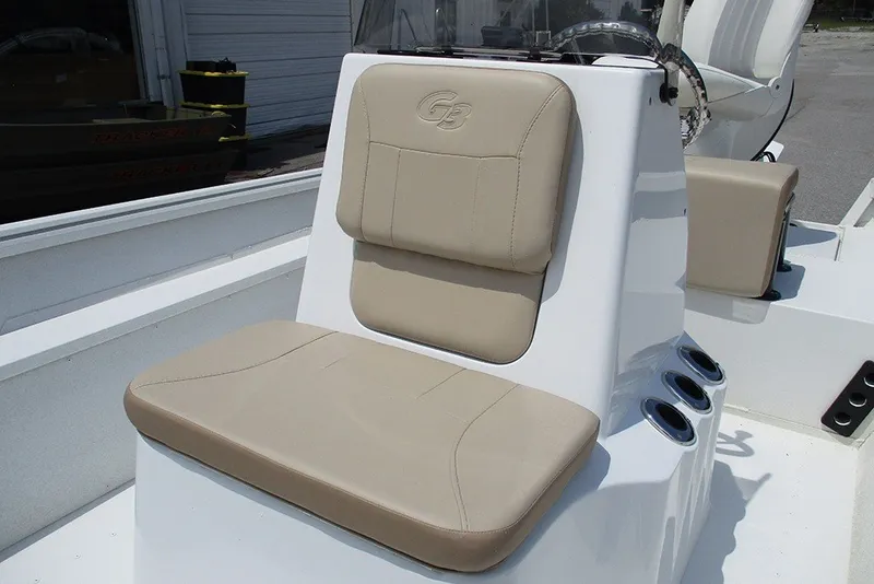 Slide: The Image of 2026 G3 Bay 17 boat seat with beige cushions and cup holders. - 18