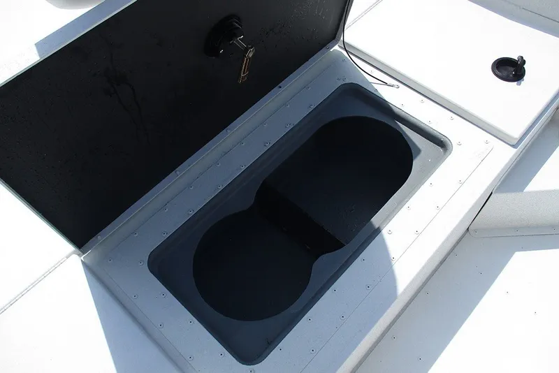 Slide: The Image of Open storage compartment on 2026 G3 Bay 17 boat deck. - 16