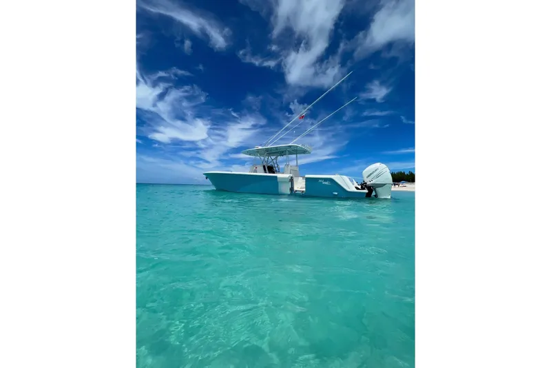 The Image of 2015 SeaVee 390Z boat on clear turquoise water under a vibrant blue sky. - 1