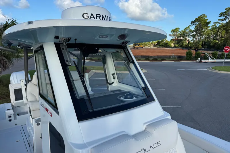 Slide: The Image of 2027 Solace 28HCS boat with Garmin equipment, parked near a construction site. - 26