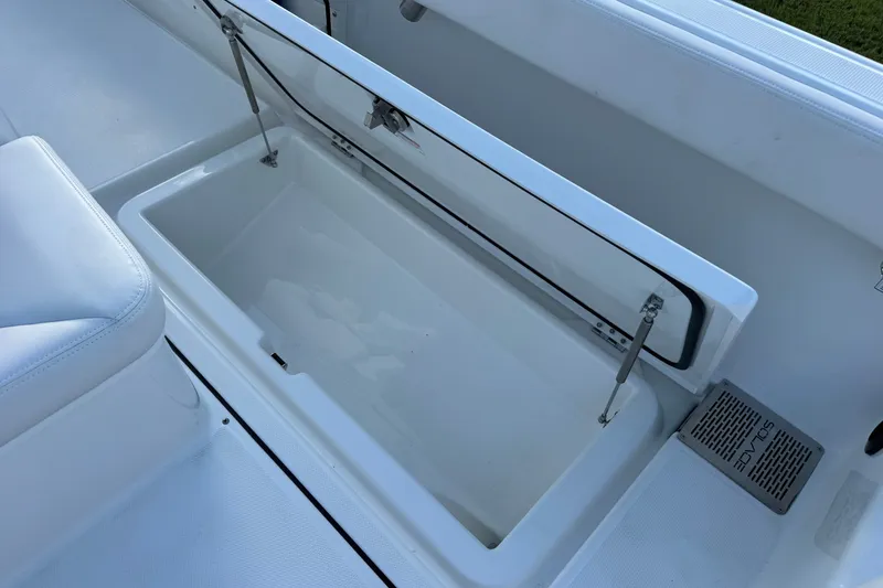 Slide: The Image of Open storage compartment on a 2027 Solace 28HCS boat, showcasing sleek design and functionality. - 17