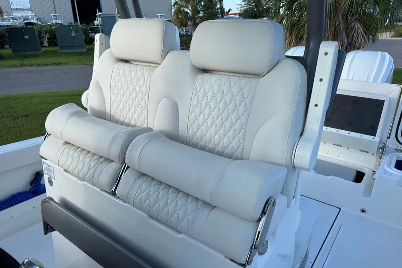 Slide: The Image of Luxurious seating on 2027 Solace 28HCS boat, featuring elegant white upholstery and ergonomic design. - 18