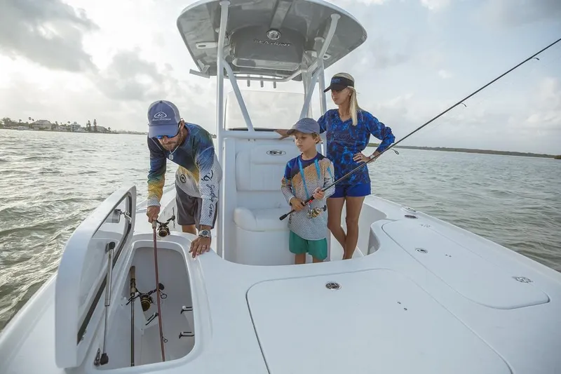 Slide: The Image of Manufacturer Provided Image: A family fishing on a 2019 Sea Hunt BX22BR boat in calm waters. - 24