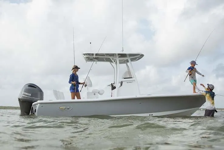 Slide: The Image of Manufacturer Provided Image: A 2019 Sea Hunt BX22BR boat on the water with three people fishing. - 21