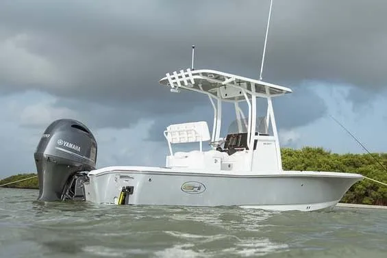 Slide: The Image of Manufacturer Provided Image: A 2019 Sea Hunt BX22BR boat floating in the water. It features a Yamaha outboard motor. - 22