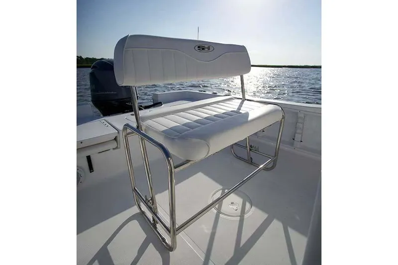 Slide: The Image of Manufacturer Provided Image: A white seat with a metal frame on a boat cruising on calm water. - 26