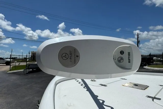 Slide: The Image of 2019 Sea Hunt BX22BR boat with Riptide i-Pilot trolling motor under clear blue sky. - 18