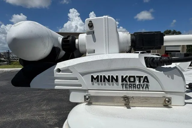 Slide: The Image of Minn Kota Terrova motor on 2019 Sea Hunt BX22BR boat under blue sky. - 17