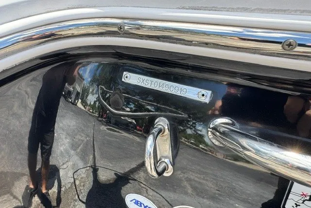 Slide: The Image of 2019 Sea Hunt BX22BR boat with visible hull identification number and chrome details. - 4