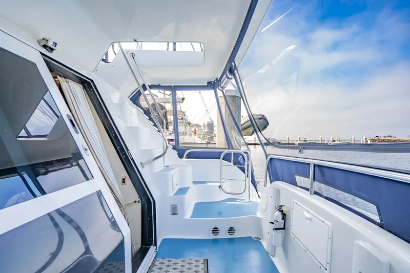 Slide: The Image of 2003 Bluewater Yachts Custom 6000 deck with modern design and ocean view. - 71