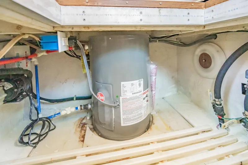 Slide: The Image of Engine room of 2003 Bluewater Yachts Custom 6000 with Rheem water heater. - 85