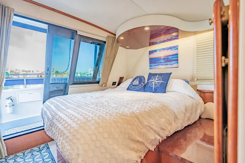 Slide: The Image of Luxurious bedroom interior of 2003 Bluewater Yachts Custom 6000 with ocean view. - 59