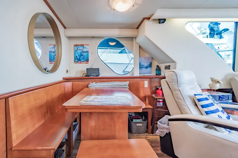 Slide: The Image of Interior of 2003 Bluewater Yachts Custom 6000, featuring cozy seating and nautical decor. - 47