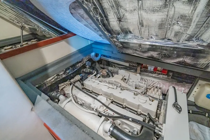Slide: The Image of Engine room of 2003 Bluewater Yachts Custom 6000, showcasing detailed mechanical components. - 90