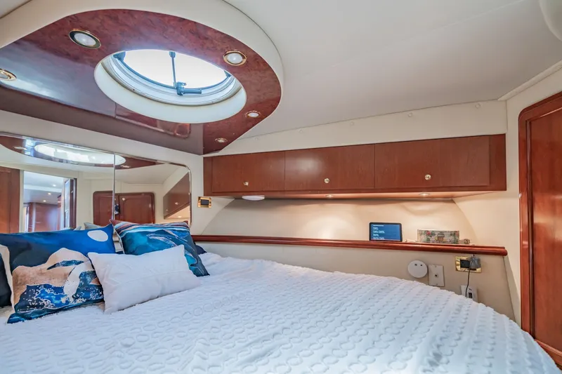 Slide: The Image of Luxurious cabin interior of 2003 Bluewater Yachts Custom 6000 with elegant wood finishes. - 54