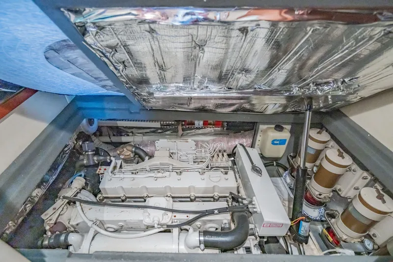 Slide: The Image of Engine room of 2003 Bluewater Yachts Custom 6000, showcasing detailed mechanical components. - 91