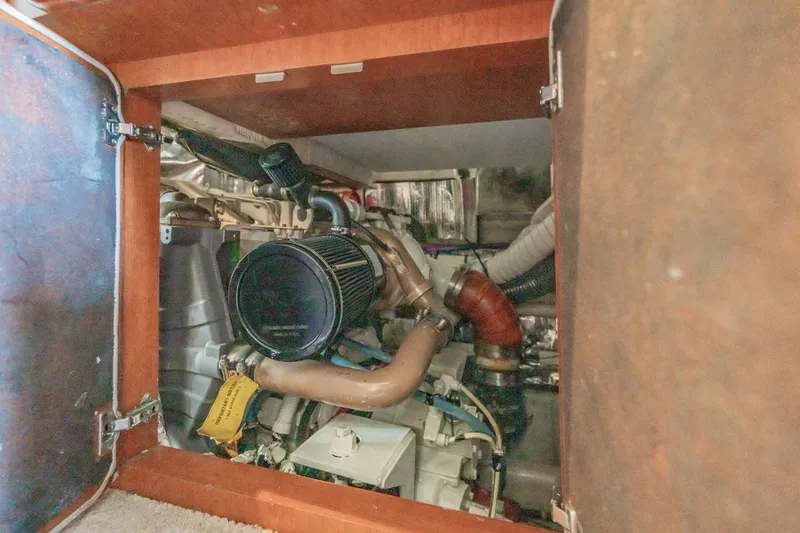Slide: The Image of Engine compartment of 2003 Bluewater Yachts Custom 6000, showcasing mechanical components. - 87