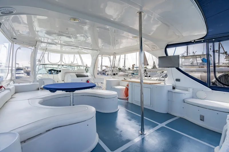 Slide: The Image of Luxurious interior of 2003 Bluewater Yachts Custom 6000 with spacious seating and modern amenities. - 12